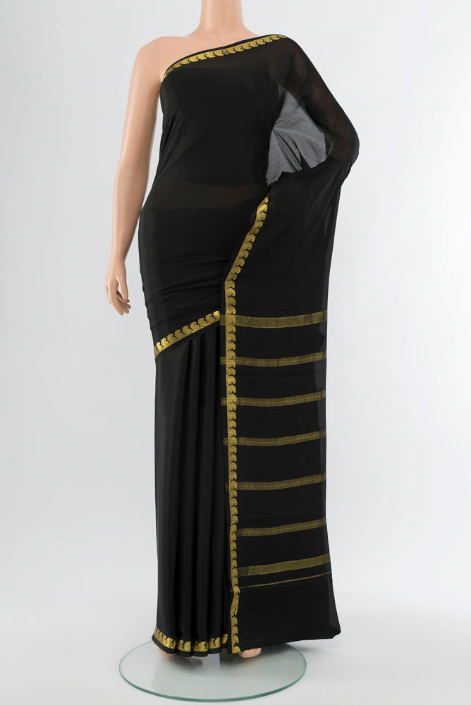 Black Mysore Crepe Saree with Plain Body and Silk Border.  displayed on a mannequin