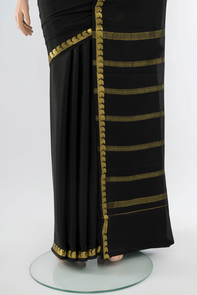 Pleats and pallu of Black Mysore Crepe Saree with Plain Body and Silk Border. 