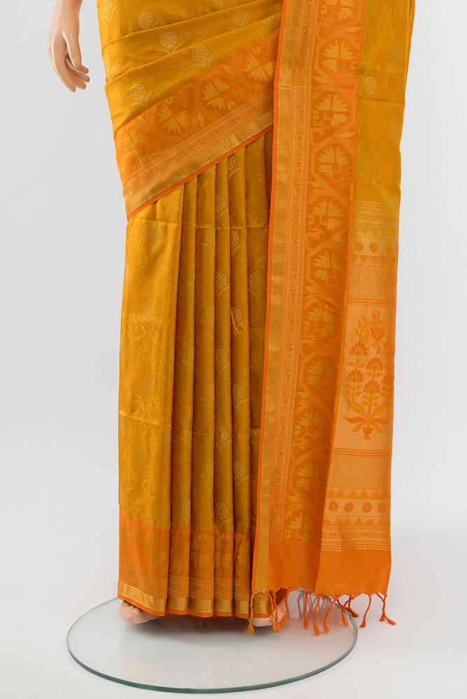 Pleats and pallu of Mustard Soft Silk Saree with Zari Butta on the body and Silk Border. 