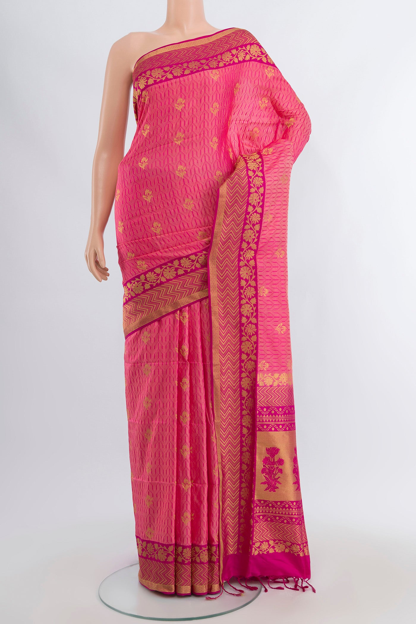 Rose Gold Soft Silk Saree with Thread Butta on the body and Silk Border.  displayed on a mannequin