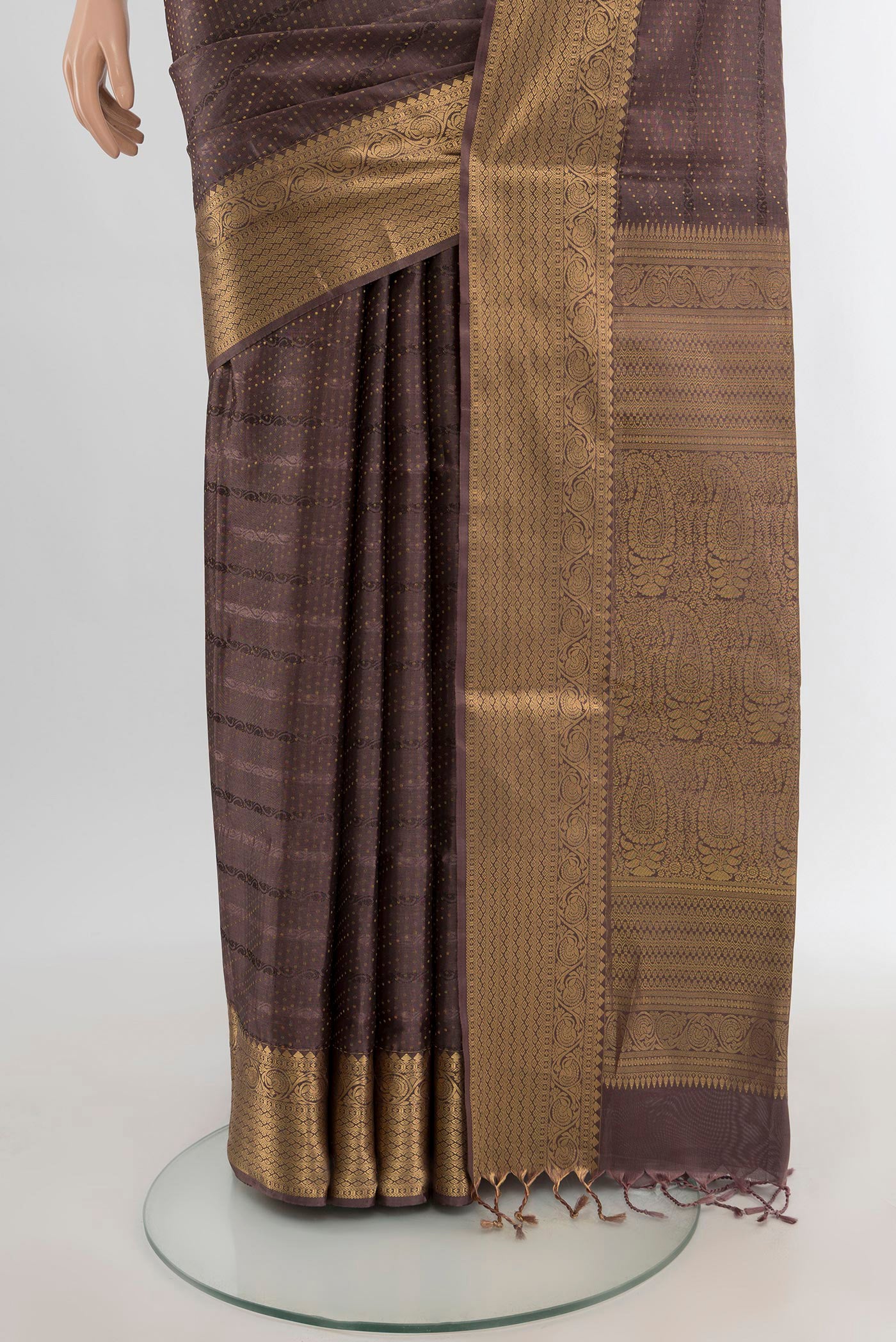 Pleats and pallu of Brown Soft Silk Saree with Jacquard With Zari Butta on the body and Zari Border. 