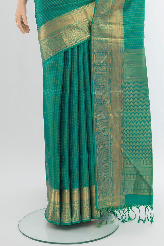 Pleats and pallu of Pure Silk Pure Zari Light Green Soft Saree with Zari Butta on the body and Silk Border. 