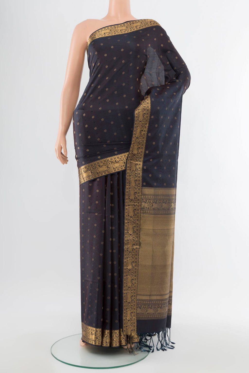 Navy Blue Soft Silk Saree with Zari Butta on the body and Silk Border.  displayed on a mannequin