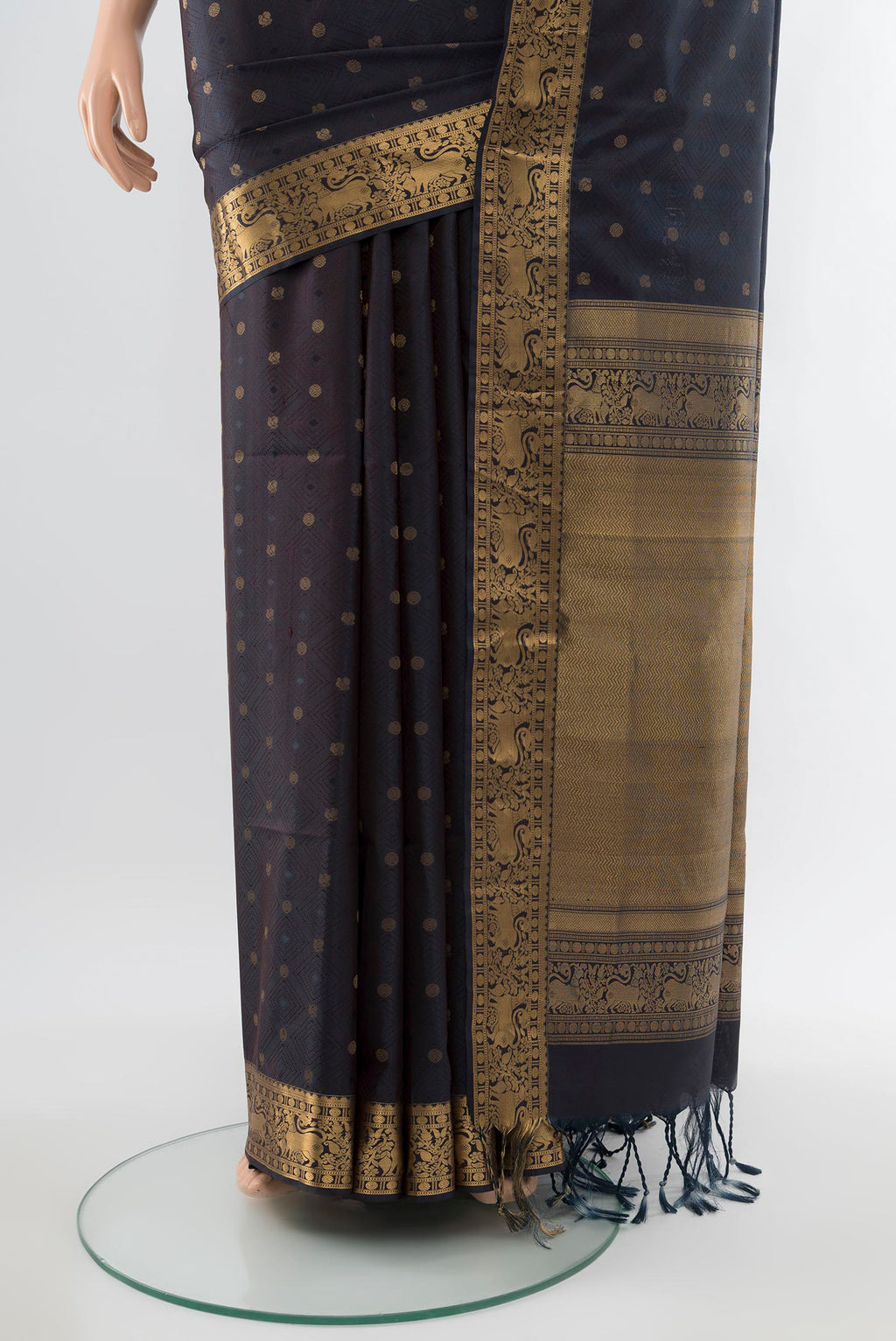 Pleats and pallu of Navy Blue Soft Silk Saree with Zari Butta on the body and Silk Border. 