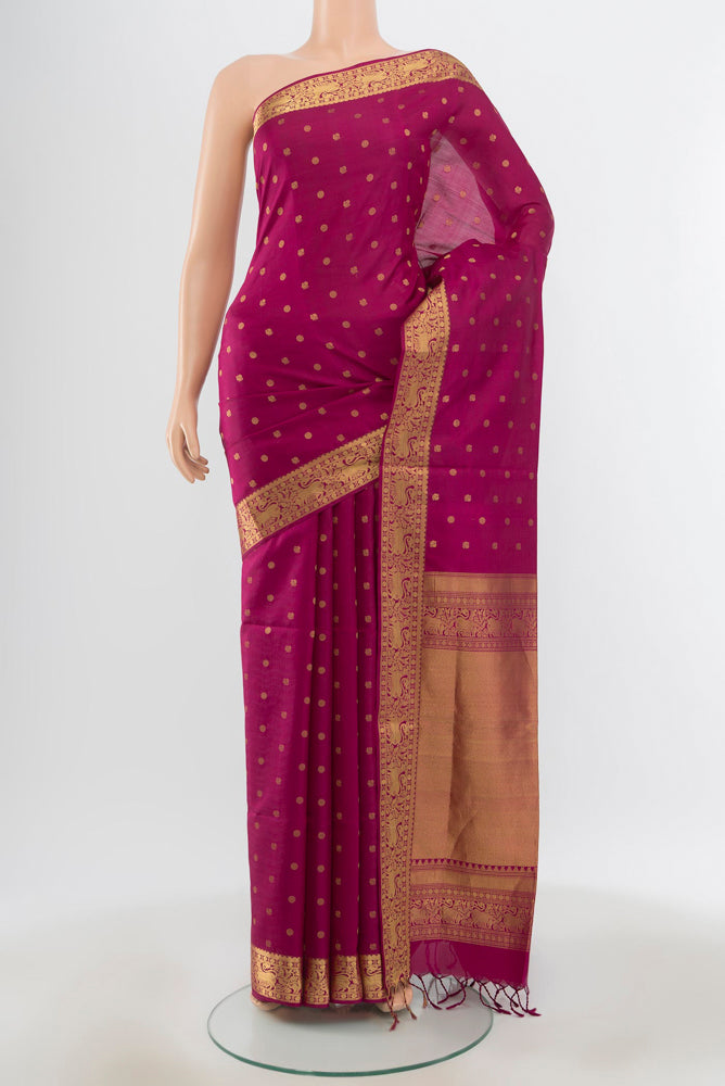 Pure Silk Pure Zari Purple Soft Saree with Zari Butta on the body and Silk Border.  displayed on a mannequin