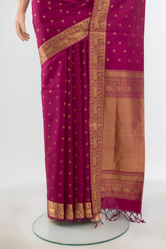 Pleats and pallu of Pure Silk Pure Zari Purple Soft Saree with Zari Butta on the body and Silk Border. 