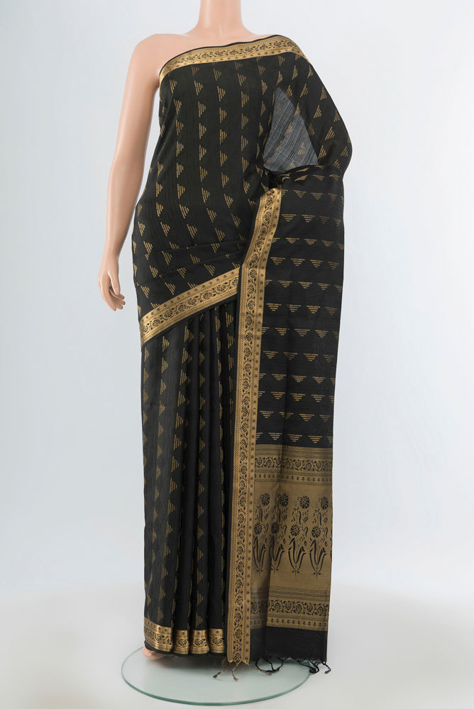 Black Soft Silk Saree with Zari Butta on the body and Silk Border.  displayed on a mannequin