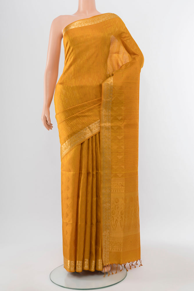 Pure Silk Pure Zari Mustard Soft Saree with Zari Butta on the body and Silk Border.  displayed on a mannequin
