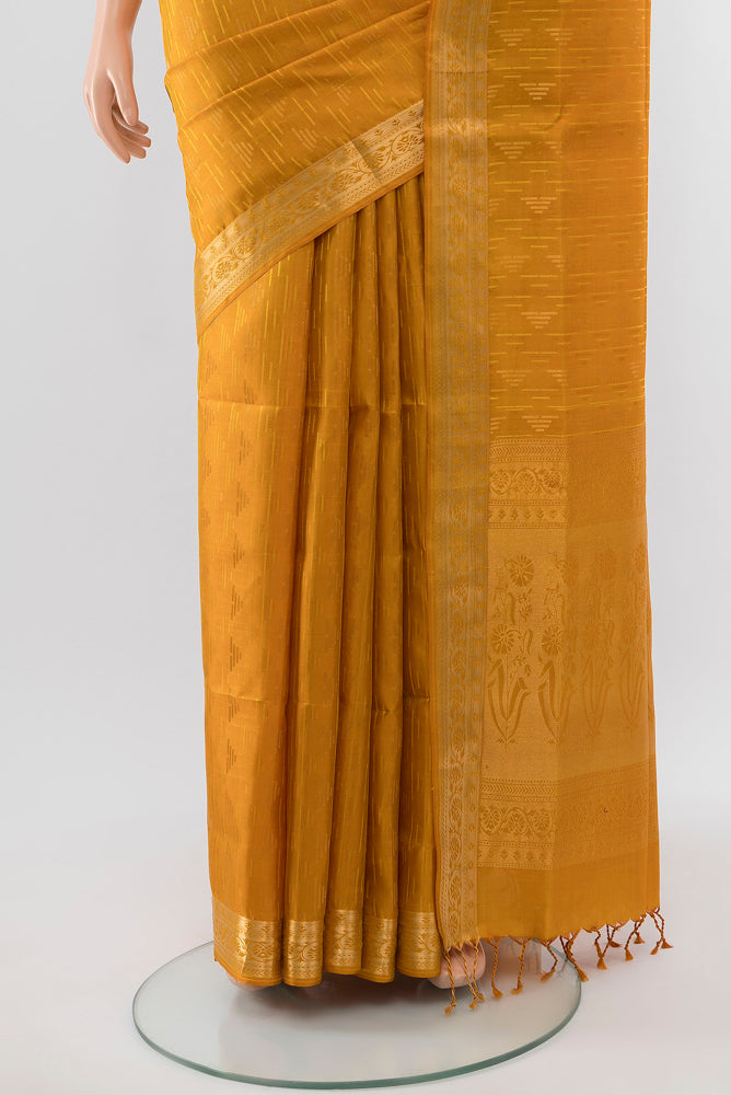 Pleats and pallu of Pure Silk Pure Zari Mustard Soft Saree with Zari Butta on the body and Silk Border. 