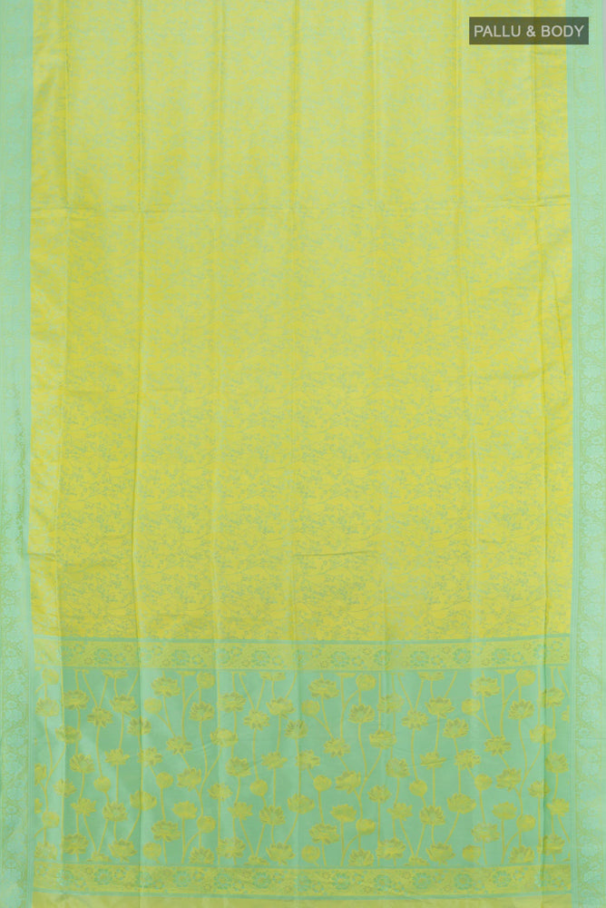 Flat view of Light Green Soft Silk Saree with Zari Butta on the body and Silk Border. 