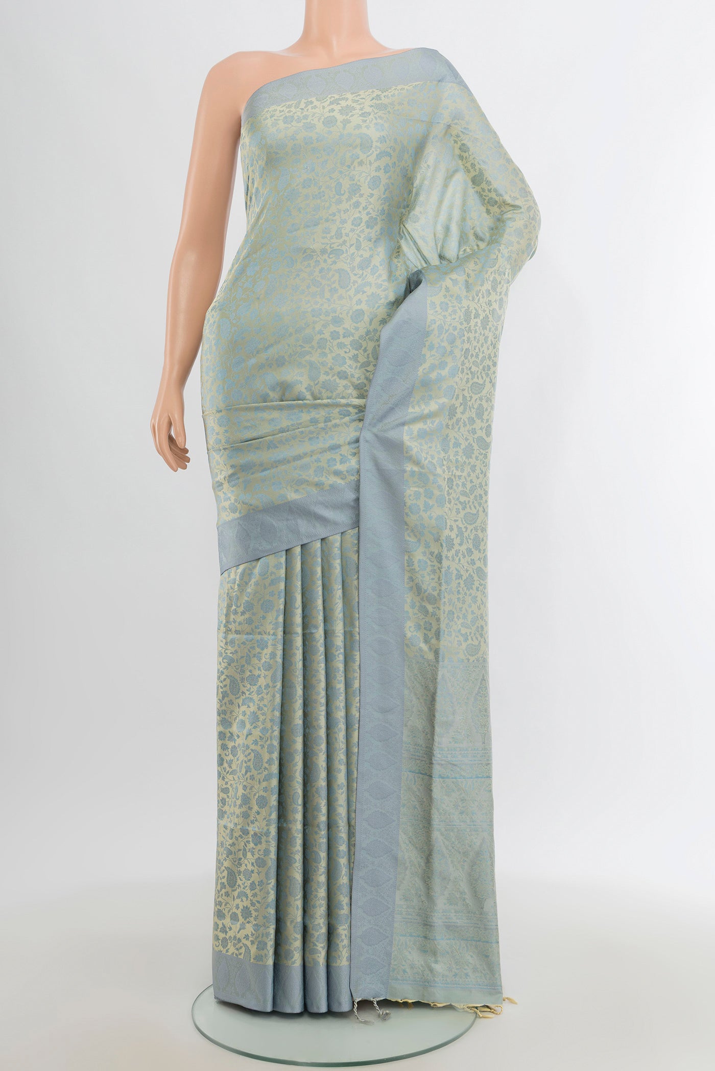 Light Blue Soft Silk Saree with Jacquard design on the body and Thread Border.  displayed on a mannequin