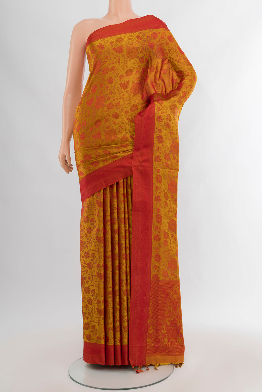 Mustard Soft Silk Saree with Jacquard design on the body and Thread Border.  displayed on a mannequin