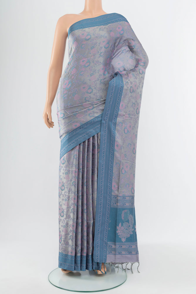 Grey Soft Silk Saree with Jacquard With Thread Butta on the body and Silk Border.  displayed on a mannequin