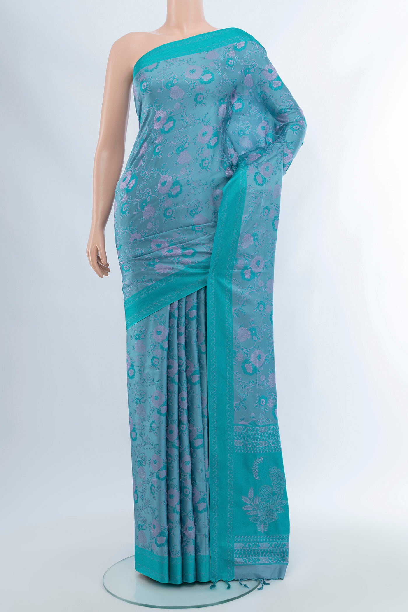 Lavender Soft Silk Saree with Thread Butta on the body and Silk Border.  displayed on a mannequin