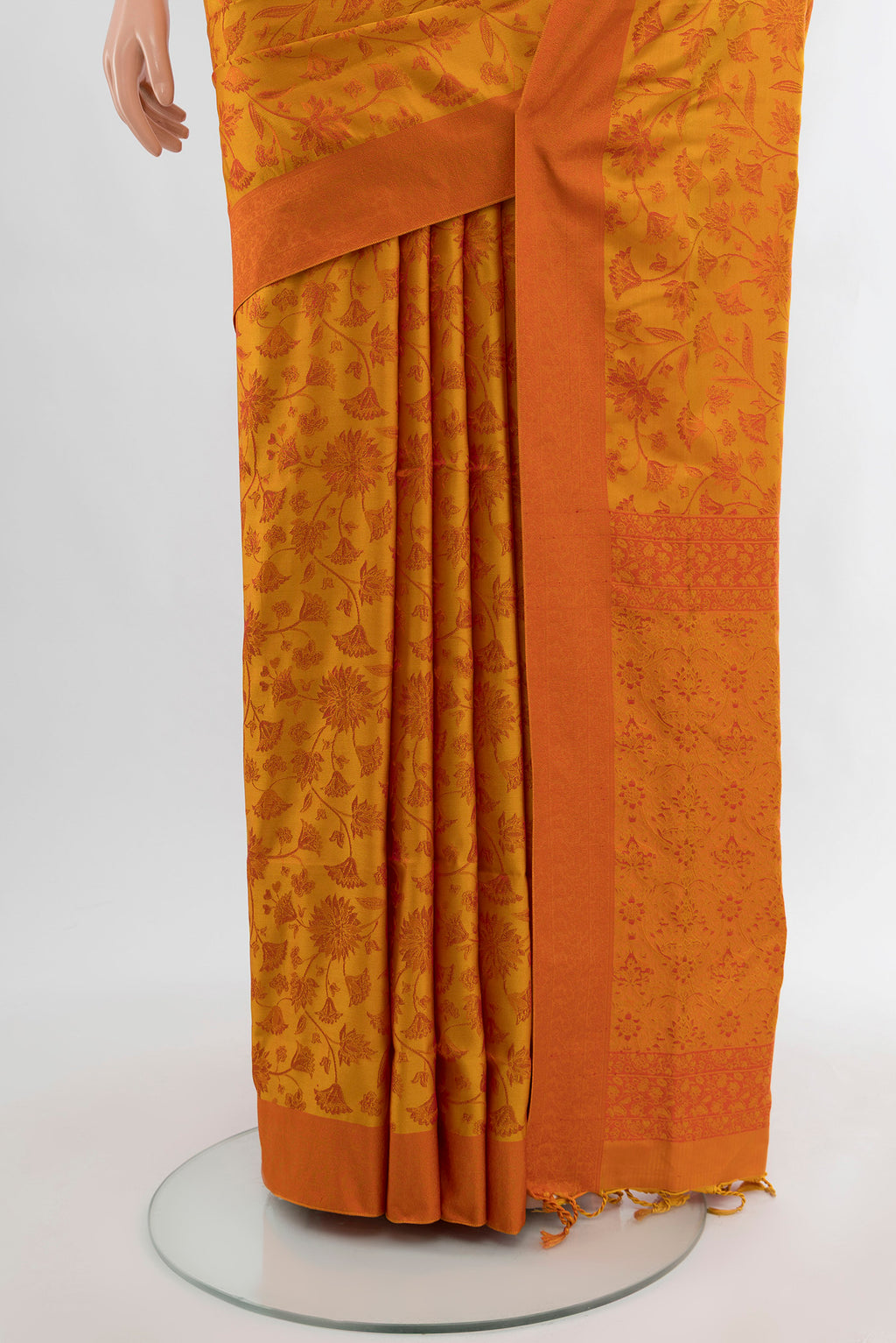 Pleats and pallu of Mustard Soft Silk Saree with Thread Butta on the body and Silk Border. 