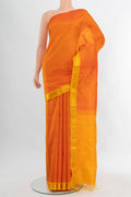 Orange Kanjivaram Silk Saree with Zari Butta on the body and One Side Border.  displayed on a mannequin