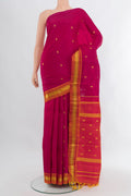 Dark Pink Kanjivaram Silk Saree with Zari Butta on the body and One Side Border.  displayed on a mannequin