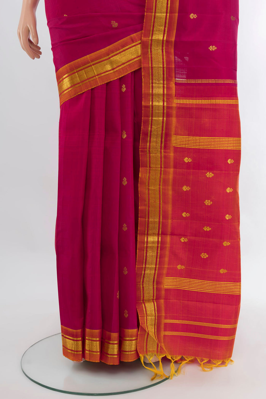 Pleats and pallu of Dark Pink Kanjivaram Silk Saree with Zari Butta on the body and One Side Border. 