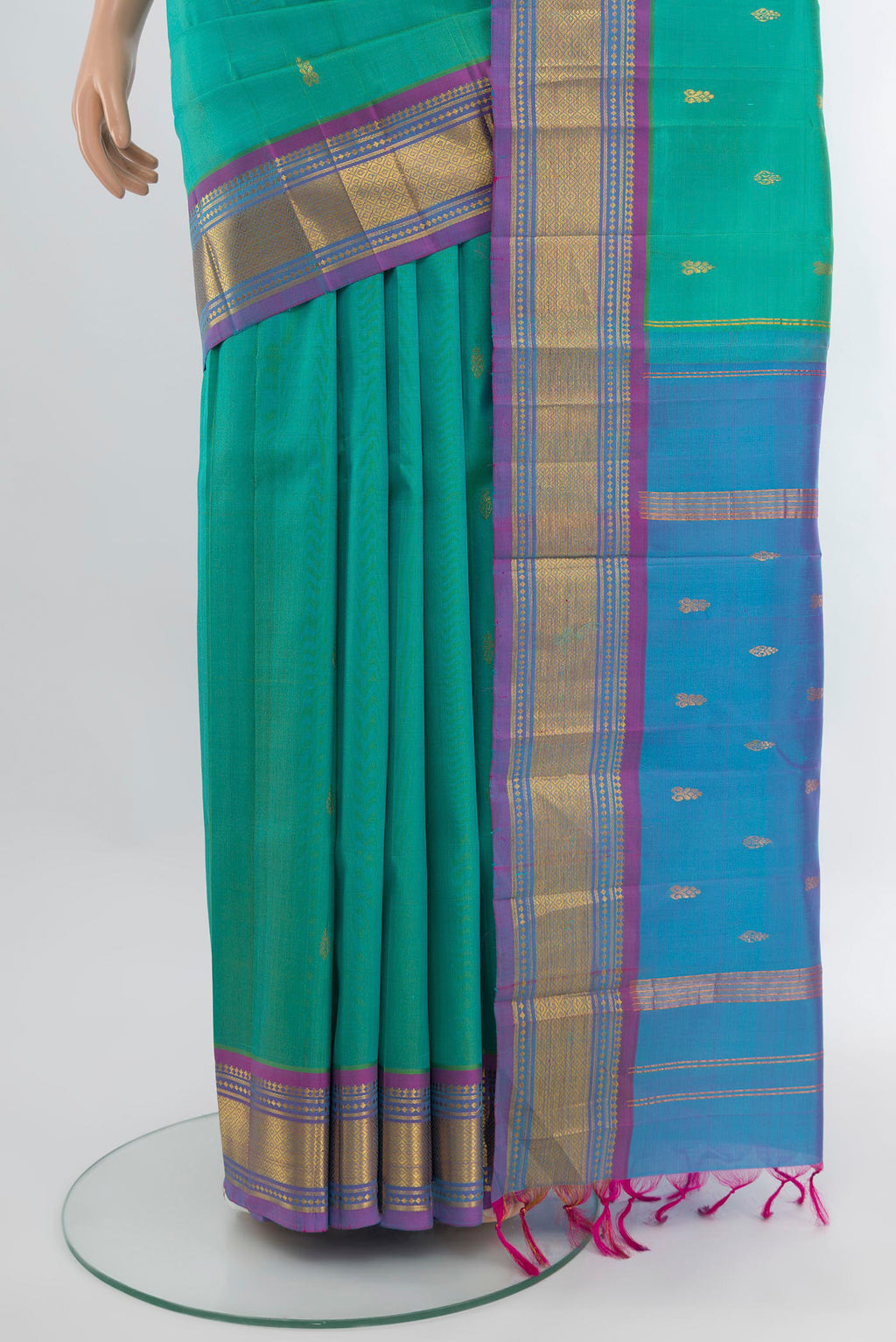Pleats and pallu of Turquoise Kanjivaram Silk Saree with Zari Butta on the body and One Side Border. 