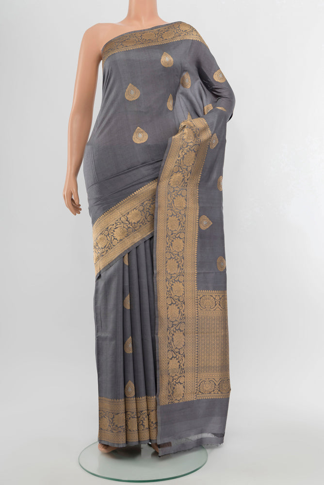 Davys Grey Banarasi Katan Silk Saree with Zari Butta on the body and Silk Border.  displayed on a mannequin
