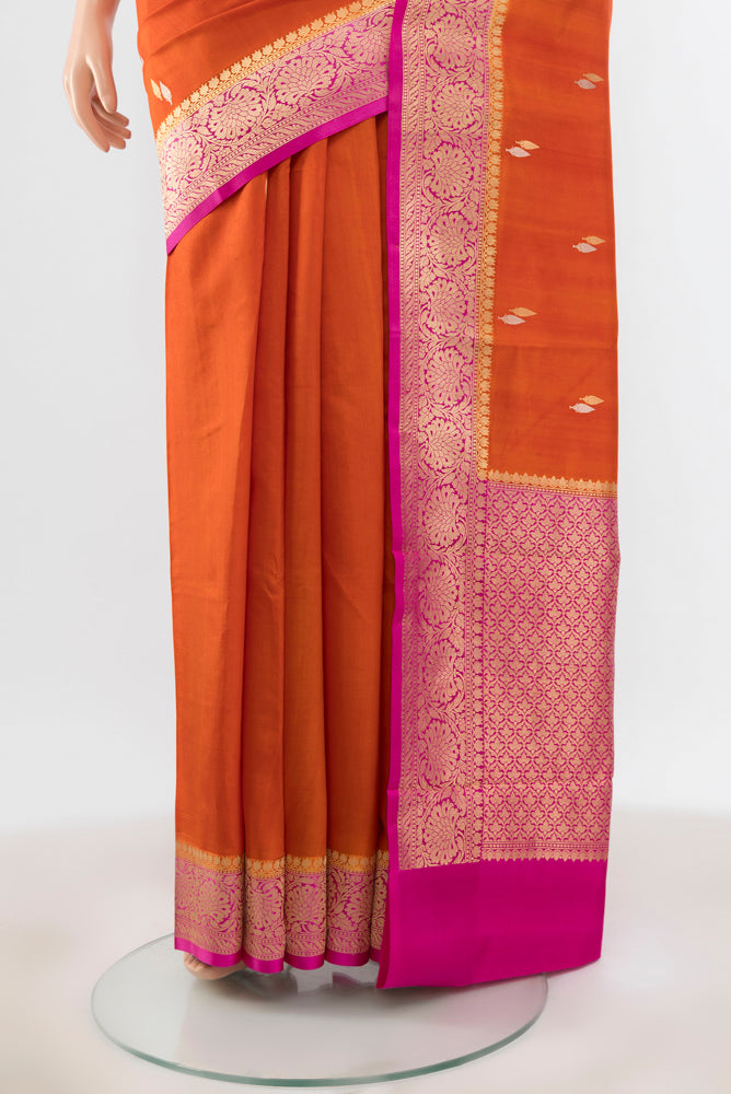 Pleats and pallu of Brick Orange Banarasi Katan Silk Saree with Zari Brocade on the body and Silk Border. 