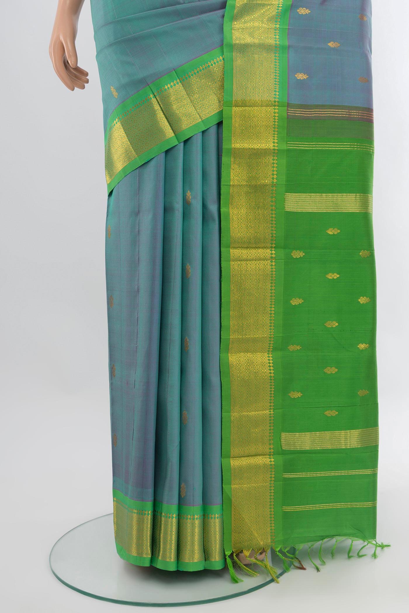 Pleats and pallu of Blue with Pink Color Kanjivaram Silk Saree with Zari Butta on the body and One Side Border. 