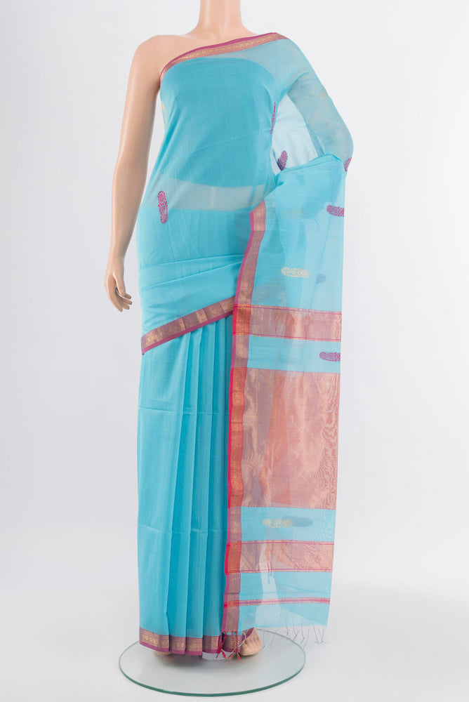 Sky Blue Maheshwari Silk Cotton Saree with Zari Butta on the body and Silk Border.  displayed on a mannequin