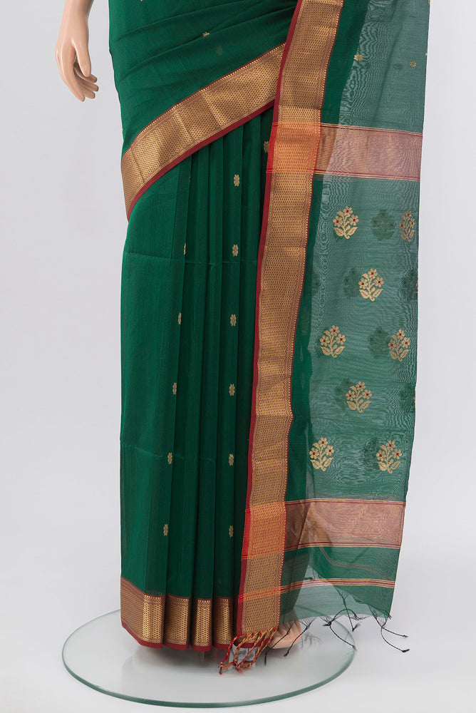 Pleats and pallu of Bottle Green Maheshwari Silk Cotton Saree with Zari Butta on the body and Silk Border. 