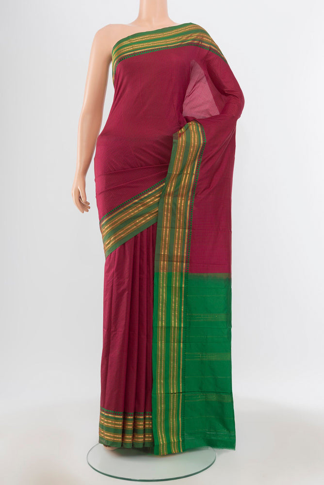 Pure Silk Pure Zari Maroon Narayanpet Saree with Zari Butta on the body and Silk Border.  displayed on a mannequin