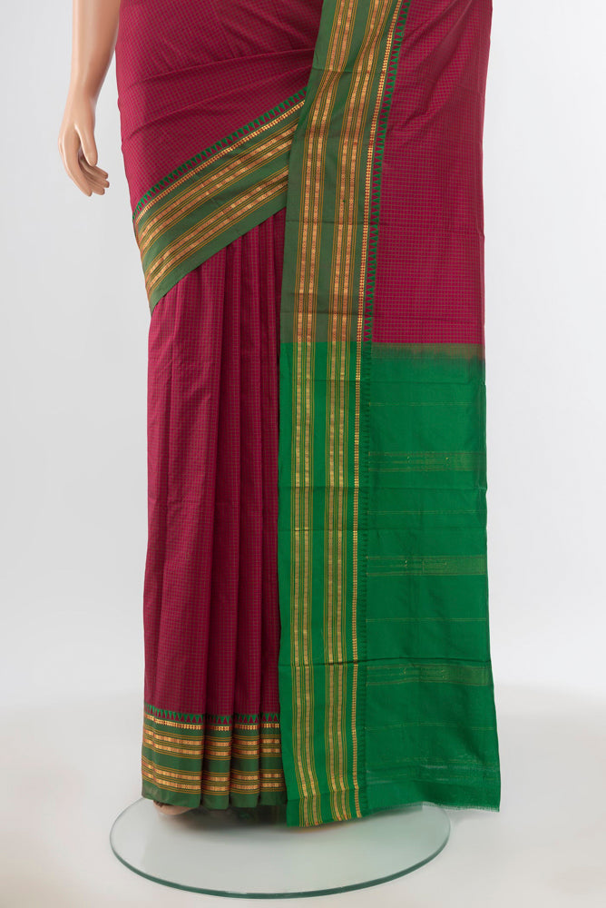 Pleats and pallu of Pure Silk Pure Zari Maroon Narayanpet Saree with Zari Butta on the body and Silk Border. 