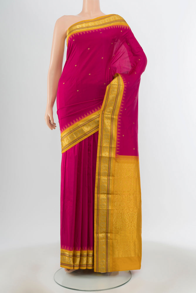 Dark Pink Narayanpet Silk Saree with Zari Butta on the body and Silk Border.  displayed on a mannequin