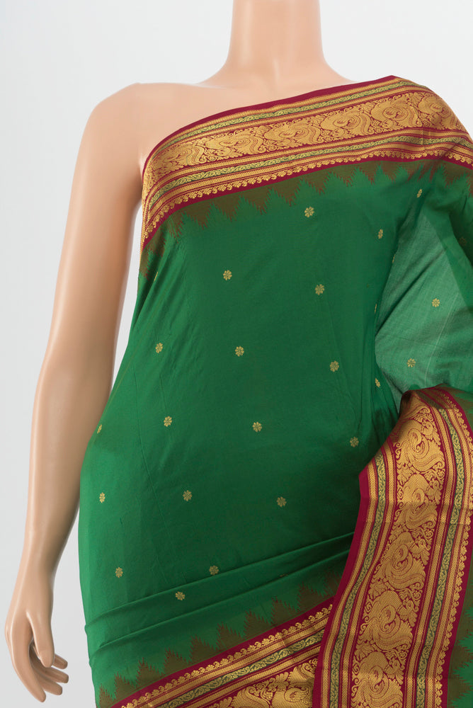 Border image of Bottle Green Pochampally Saree with Zari Butta on the body and Silk Border. 