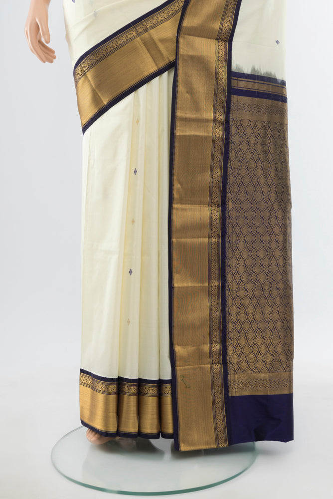 Pleats and pallu of Cream Narayanpet Silk Saree with Zari Butta on the body and Silk Border. 