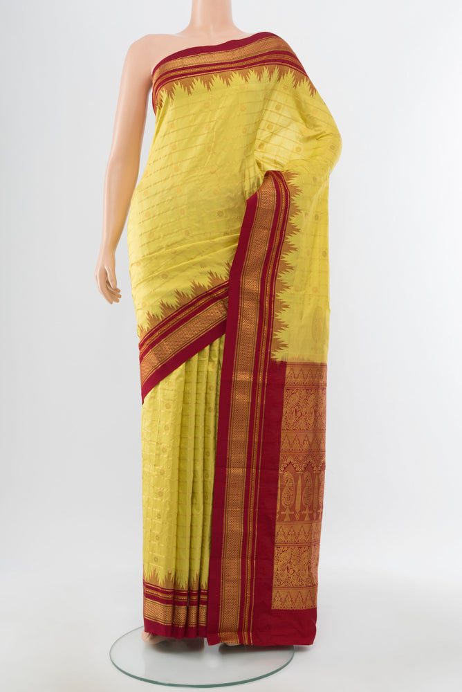 Light Green Narayanpet Silk Saree with Zari Butta on the body and Silk Border.  displayed on a mannequin