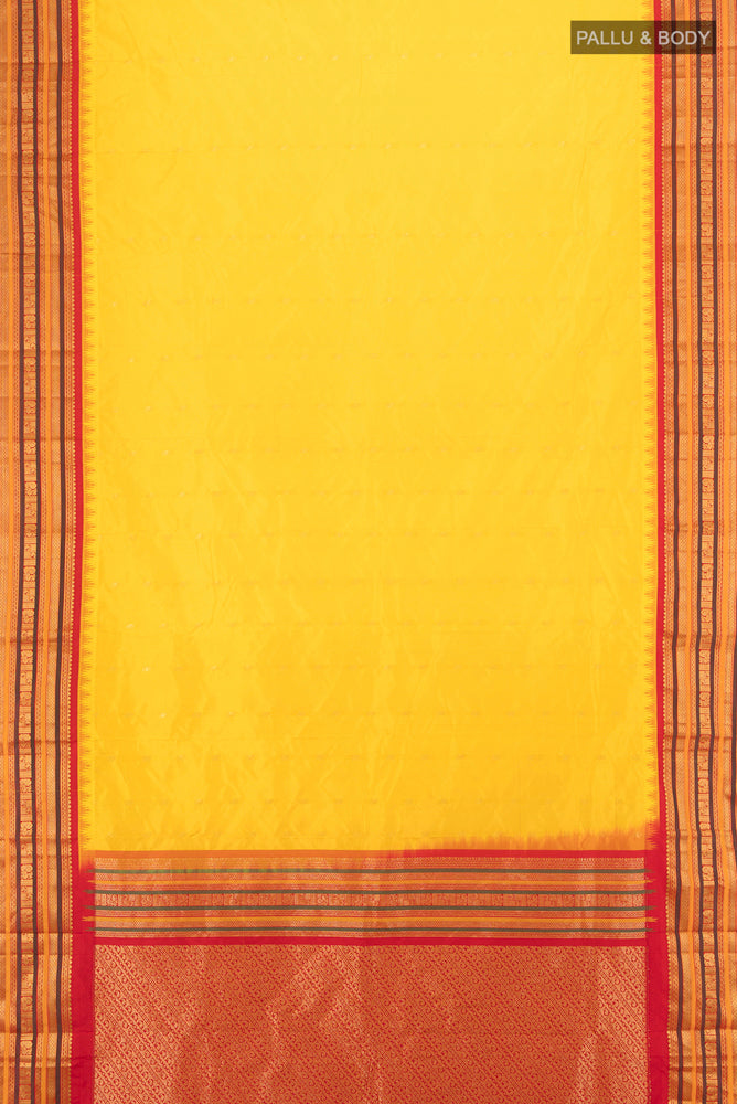 Flat view of Yellow Bangalore Silk Saree with Zari Butta on the body and Silk Border. 