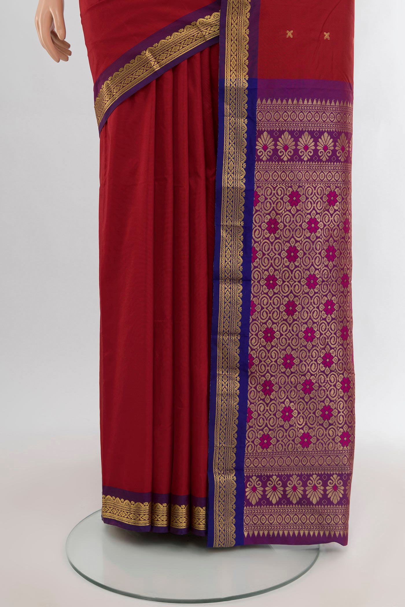 Pleats and pallu of Maroon Blended Bangalore Silk Saree with Zari Butta on the body and Zari Border. 