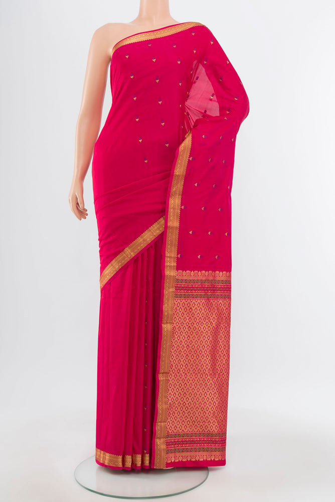 Pure Silk Pure Zari Rani Pink Bangalore Saree with Zari Brocade on the body and Silk Border.  displayed on a mannequin