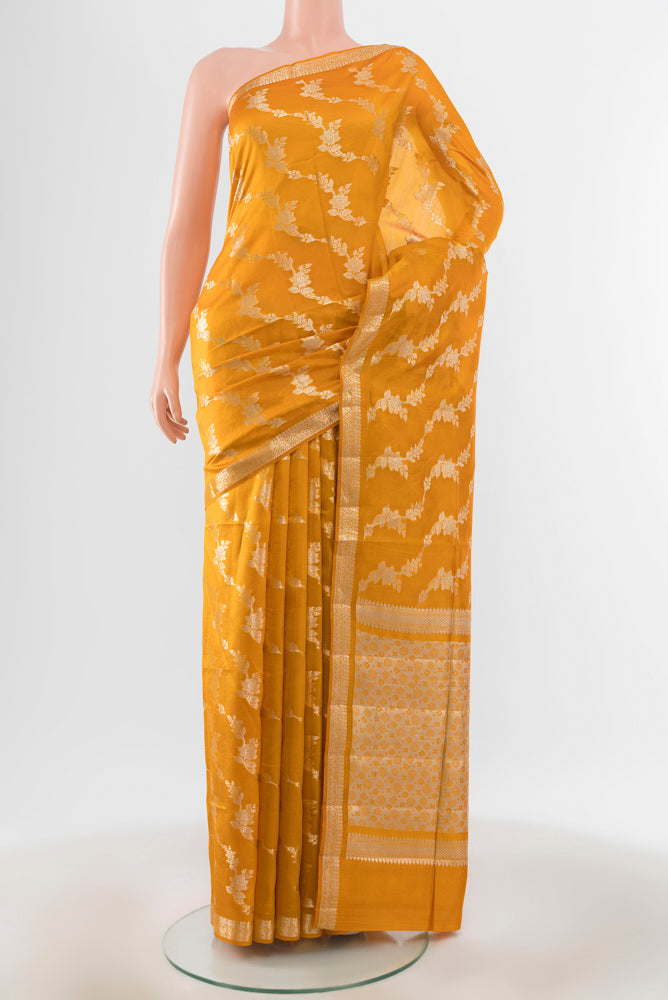 Mustard Banarasi Raw Silk Saree with Zari Brocade on the body and Silk Border.  displayed on a mannequin