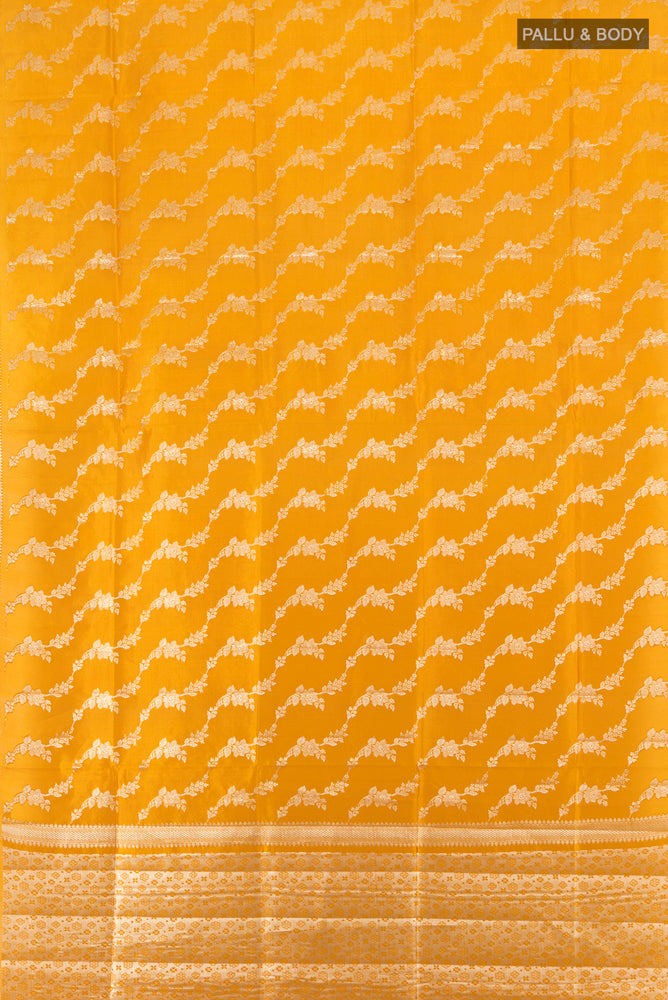 Flat view of Mustard Banarasi Raw Silk Saree with Zari Brocade on the body and Silk Border. 