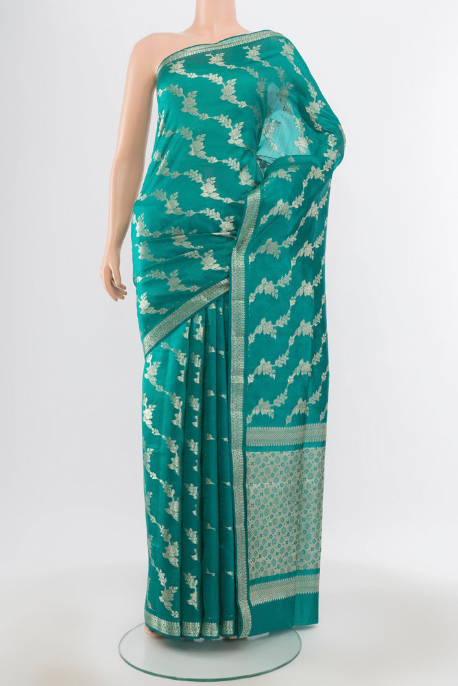 Pure Silk Pure Zari Dark Mauve Banarasi Raw Saree with Zari Butta on the body and Silk Border.  displayed on a mannequin