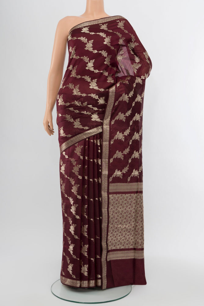Coffee Brown Banarasi Raw Silk Saree with Zari Butta on the body and Silk Border.  displayed on a mannequin