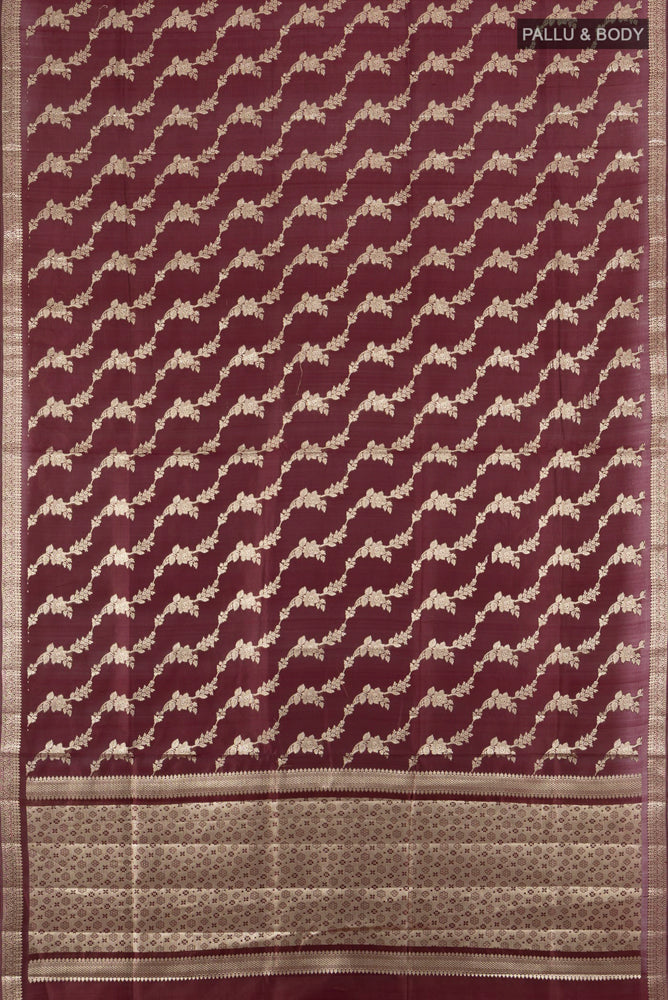 Flat view of Coffee Brown Banarasi Raw Silk Saree with Zari Butta on the body and Silk Border. 