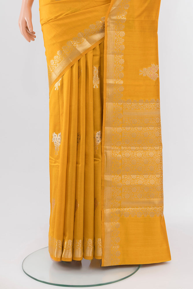 Pleats and pallu of Yellow Banarasi Katan Silk Saree with Zari Butta on the body and Silk Border. 