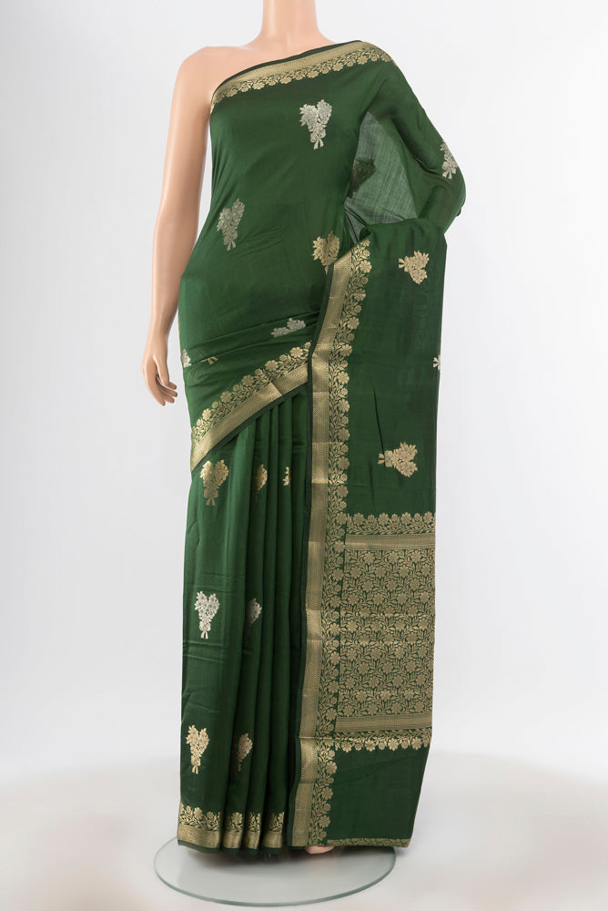 Pure Silk Pure Zari Bottle Green Banarasi Raw Saree with Zari Butta on the body and Silk Border.  displayed on a mannequin