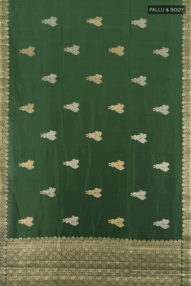 Flat view of Pure Silk Pure Zari Bottle Green Banarasi Raw Saree with Zari Butta on the body and Silk Border. 