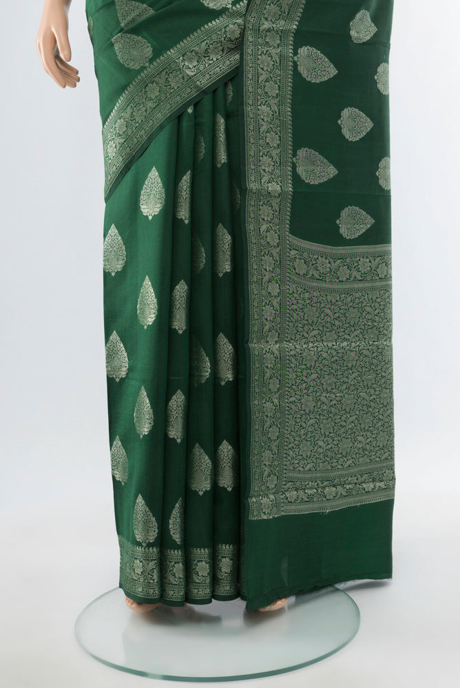 Pleats and pallu of Mint Green Banarasi Raw Silk Saree with Zari Butta on the body and Silk Border. 