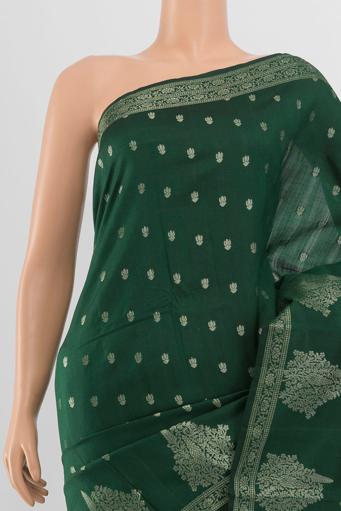 Border image of Mint Green Tussar Saree with Zari Butta on the body and Silk Border. 