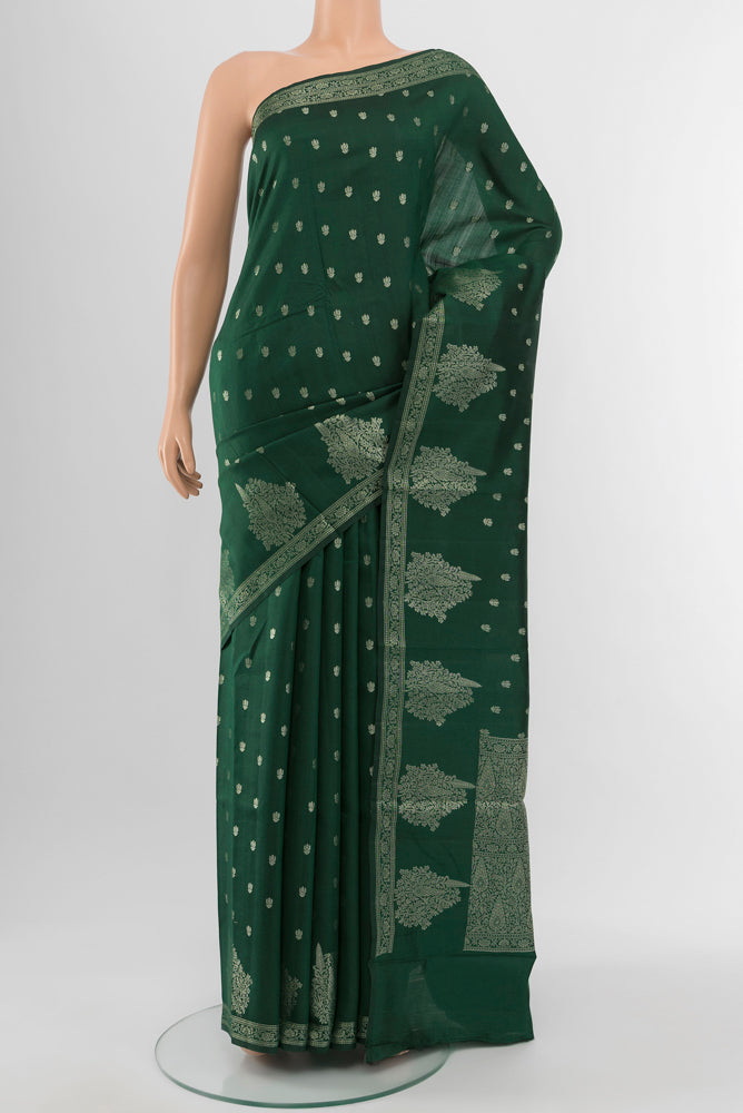 Mint Green Tussar Saree with Zari Butta on the body and Silk Border.  displayed on a mannequin