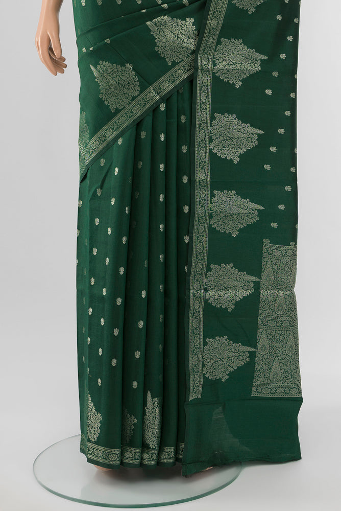 Pleats and pallu of Mint Green Tussar Saree with Zari Butta on the body and Silk Border. 