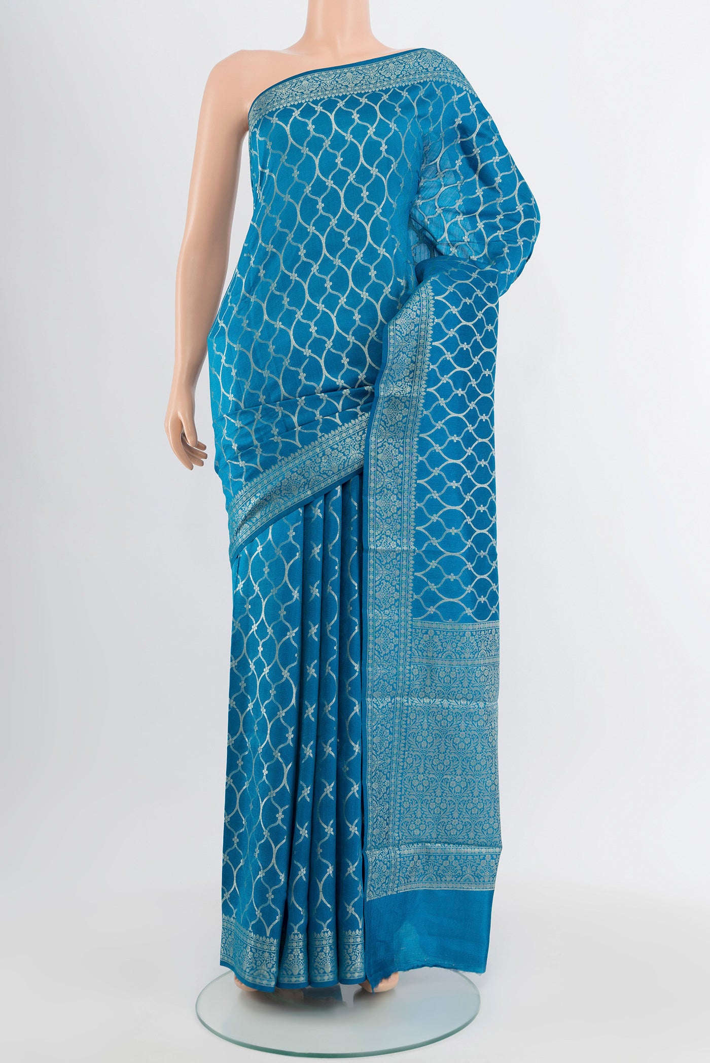 Dark Blue Banarasi Raw Silk Saree with Zari Butta on the body and Silk Border.  displayed on a mannequin